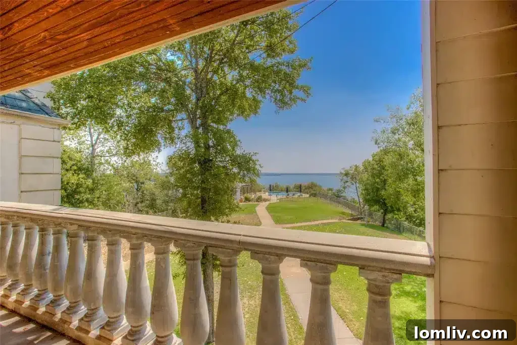 A spacious and comfortable living room area within the estate, featuring large windows offering lake views.