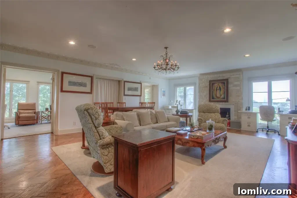 Luxurious primary bedroom suite with a private sitting area and panoramic views of Eagle Mountain Lake.