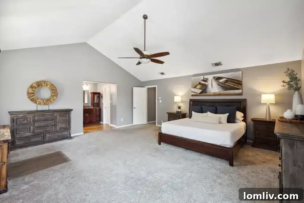 Luxurious primary bathroom featuring a large soaking tub and separate shower, designed for relaxation.