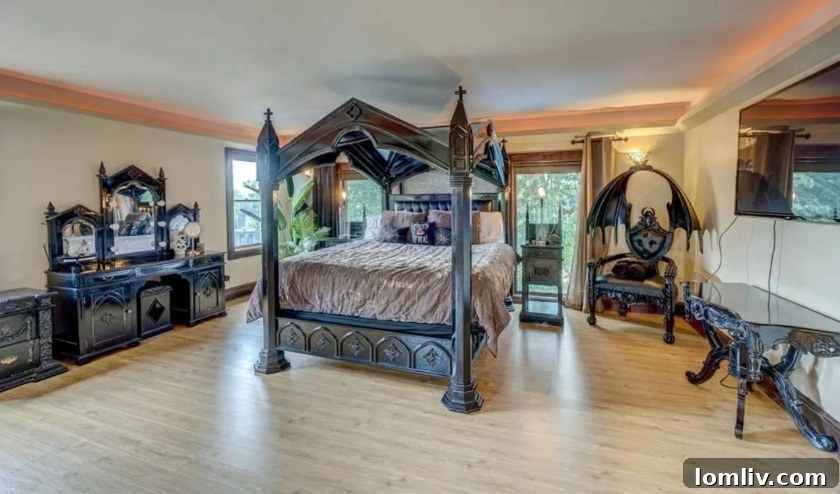 Wisconsin's One-of-a-Kind Pepto Pink Goth Barbie Dreamhouse For Sale 17 Stripper pole in a themed bedroom, blending fantasy with fun