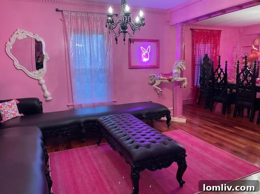 Wisconsin's One-of-a-Kind Pepto Pink Goth Barbie Dreamhouse For Sale 7 Living room decor featuring pastel logs and dark furniture