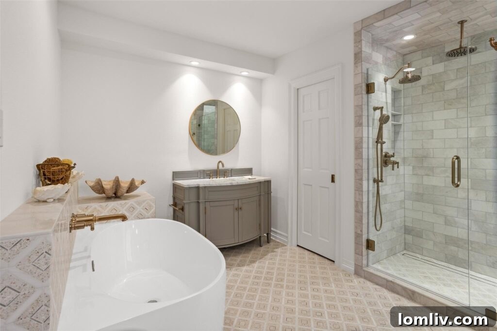 Rare Midcentury Gem in Rivercrest First Time Offered 11 Elegant primary bathroom with unique pendant lighting and stylish finishes