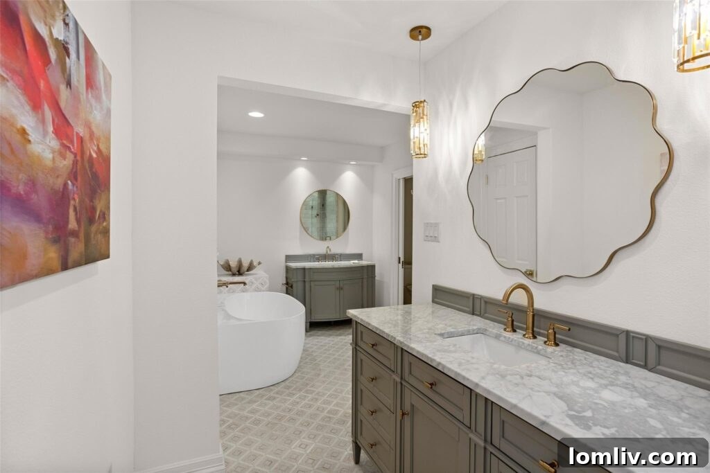 Rare Midcentury Gem in Rivercrest First Time Offered 10 Luxurious primary bathroom with unique mirror and organic shaped tub