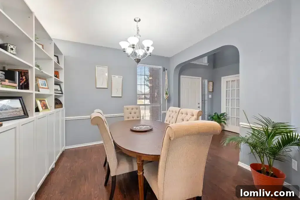 Spacious living room designed for entertaining, featuring comfortable seating and direct access to the outdoor patio.