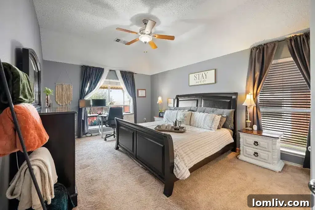 Luxurious primary bedroom, offering ample space and natural light for a tranquil retreat.