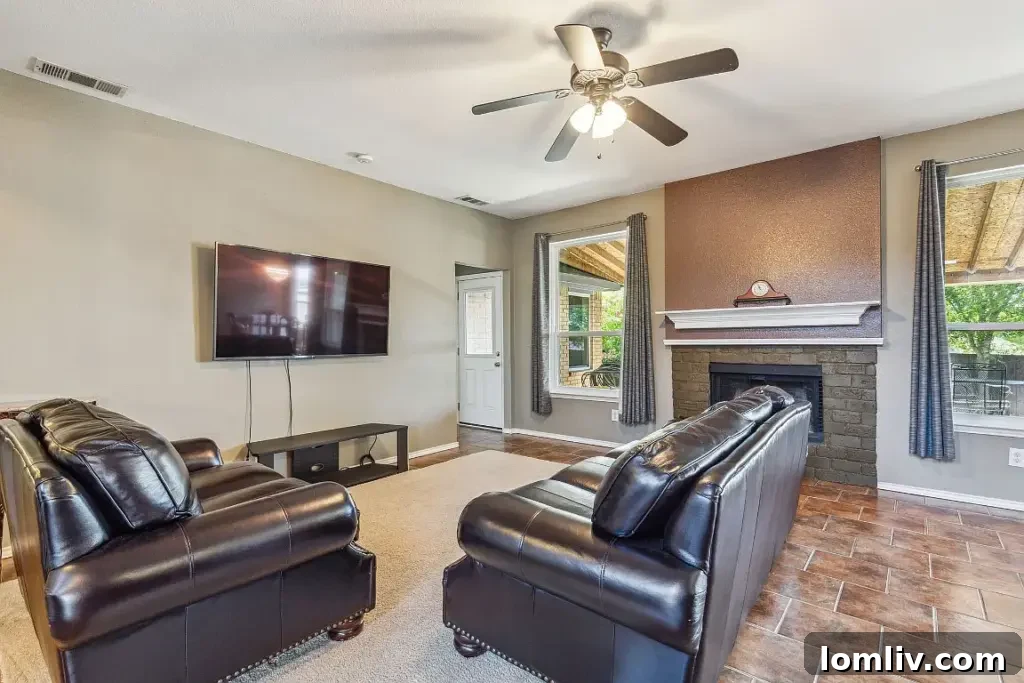 Bright and inviting living room featuring bamboo flooring, ample space, and natural light in Sachse, TX home.