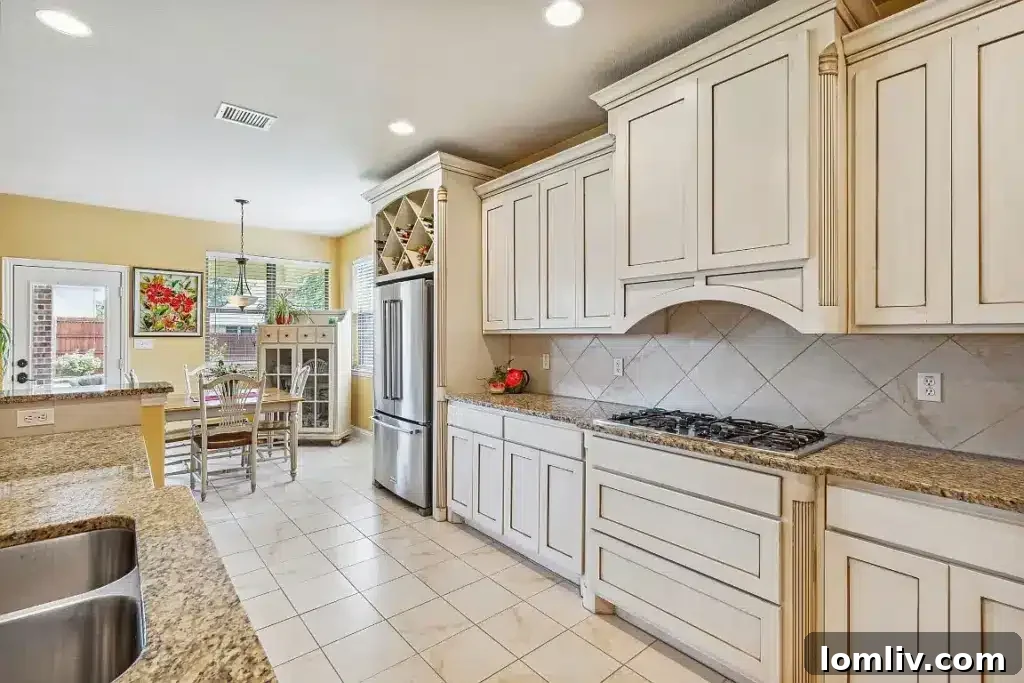 Luxurious primary bathroom with dual vanities, a separate shower, and a soaking tub, reflecting modern spa-like amenities.