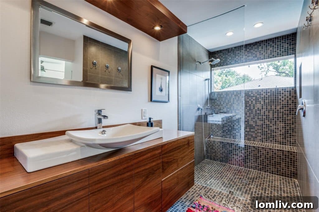 Rare East Dallas Ju-Nel Gem Hits The Market Open This Weekend 13 A contemporary bathroom with clean lines, reflecting the refreshed Mid-Century Modern aesthetic.
