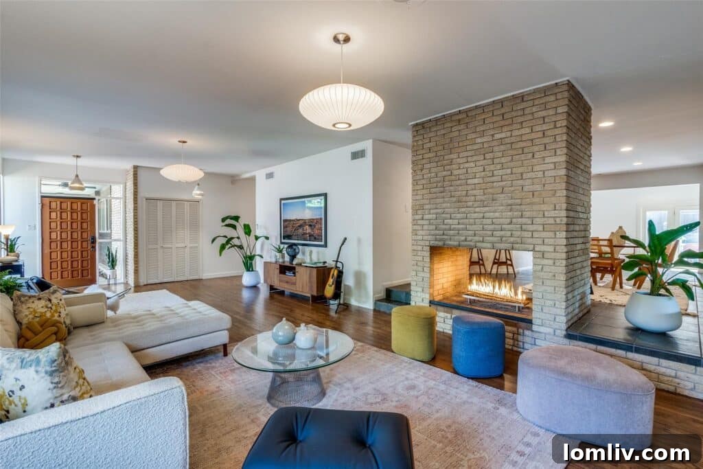 Rare East Dallas Ju-Nel Gem Hits The Market Open This Weekend 4 The central two-way fireplace crafted from blond brick, connecting the living room and kitchen in a Ju-Nel home.