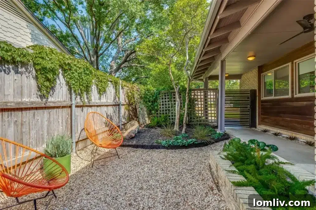 Rare East Dallas Ju-Nel Gem Hits The Market Open This Weekend 8 The serene firepit area with ample seating, perfect for evening gatherings in the backyard oasis.