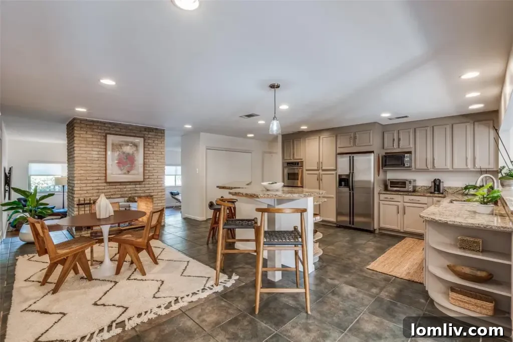 Rare East Dallas Ju-Nel Gem Hits The Market Open This Weekend 10 The gated walkway leading to a low-maintenance side yard with seating, enhancing the home's entertainment spaces.