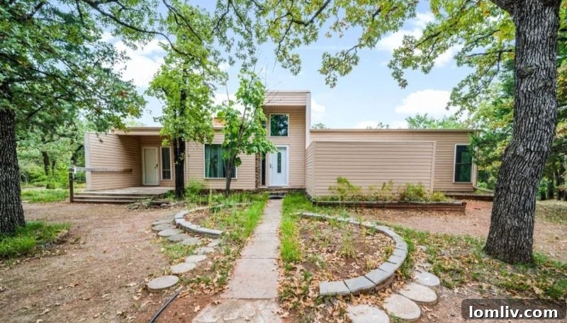 The peculiar exterior of the Oklahoma City house at 11800 Blackjack Rd, featuring two distinct front doors.