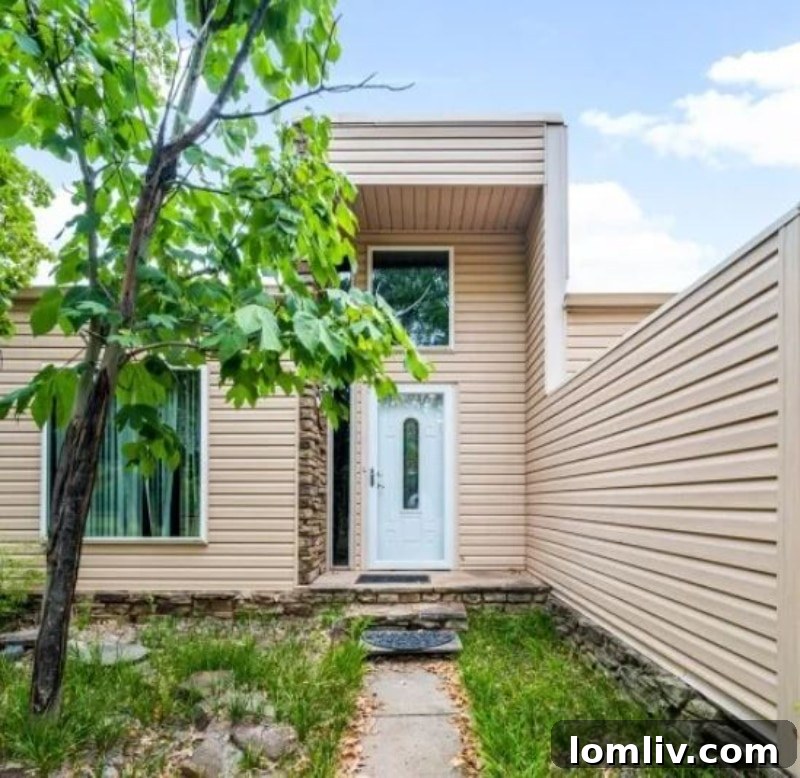The unusual front facade of the Oklahoma City house, highlighting its unique architectural choices.