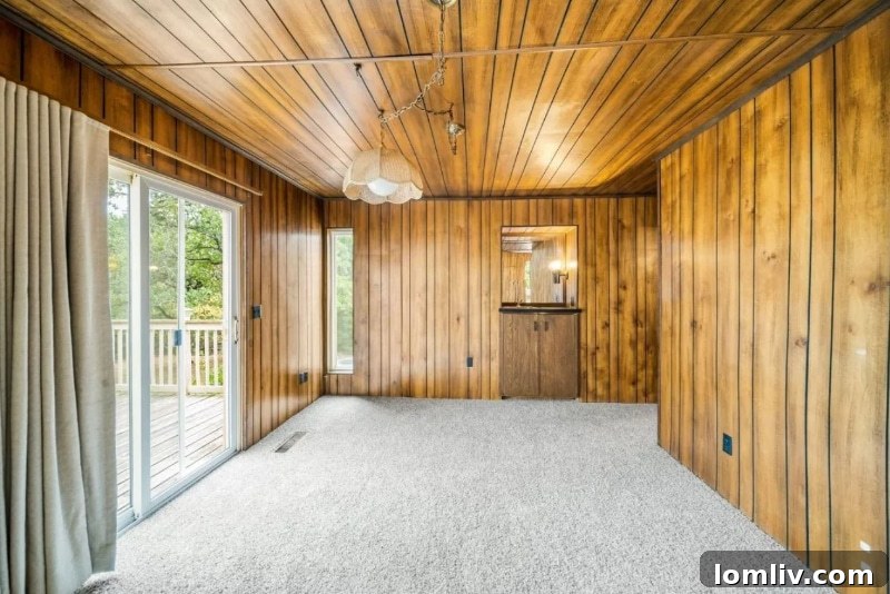 A corner of a room showcasing the extensive brown wood paneling characteristic of 1970s interior design in the Oklahoma City house.