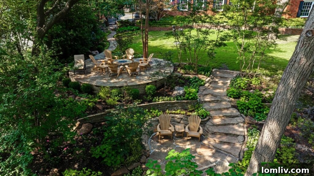 Beautifully lit backyard at dusk, showcasing landscape lighting highlighting trees, pathways, and water features