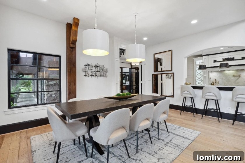 Cozy seating area with a stone fireplace and comfortable sofa in a renovated Argyle luxury home