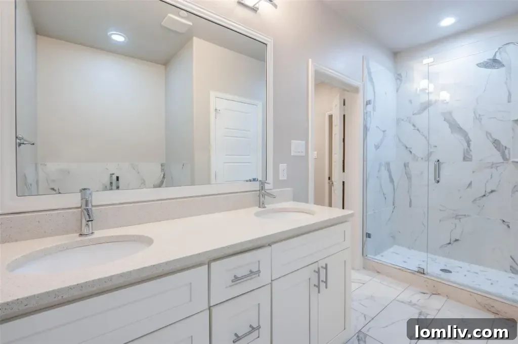 Luxurious Primary Bathroom with Freestanding Tub and Marble Finishes
