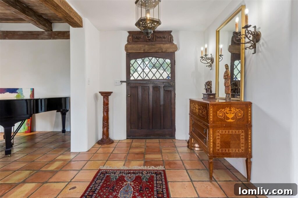 The grand entrance and hallway of the Fort Worth hacienda, featuring elegant design elements.