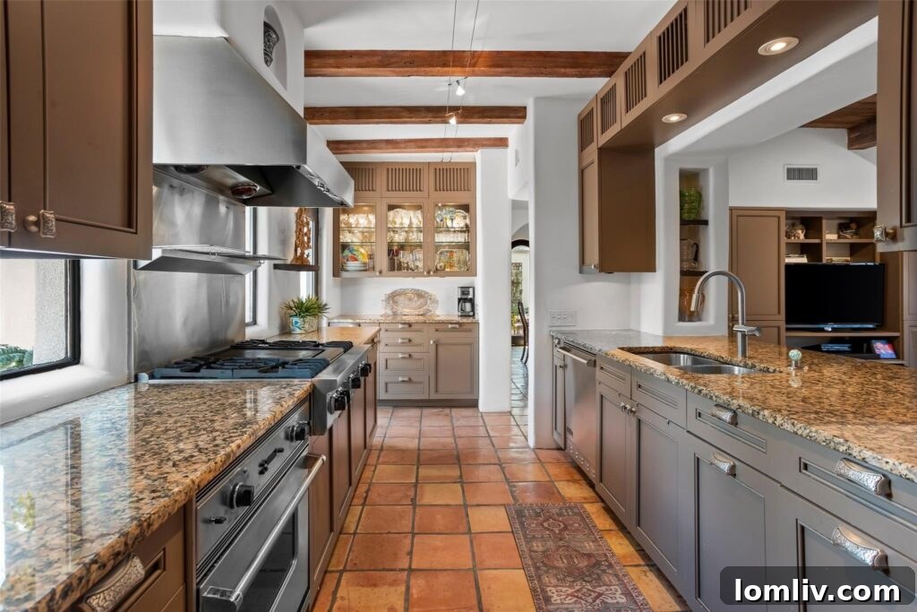 Spacious kitchen with modern appliances and ample storage, awaiting a personal touch.