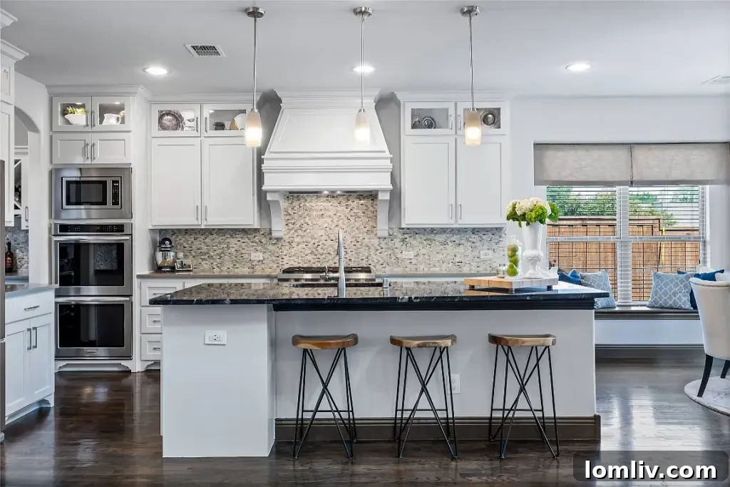 Gourmet kitchen with stainless steel appliances and open-plan living area in a luxury home