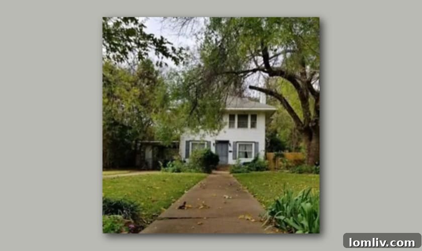 Heritage Oak Cliff: 2023 Home Tour of Historic Charm 4 The historic house on Rosemont Avenue, Dallas, depicted without its crucial front porch, illustrating the impact of neglect on its architectural identity.
