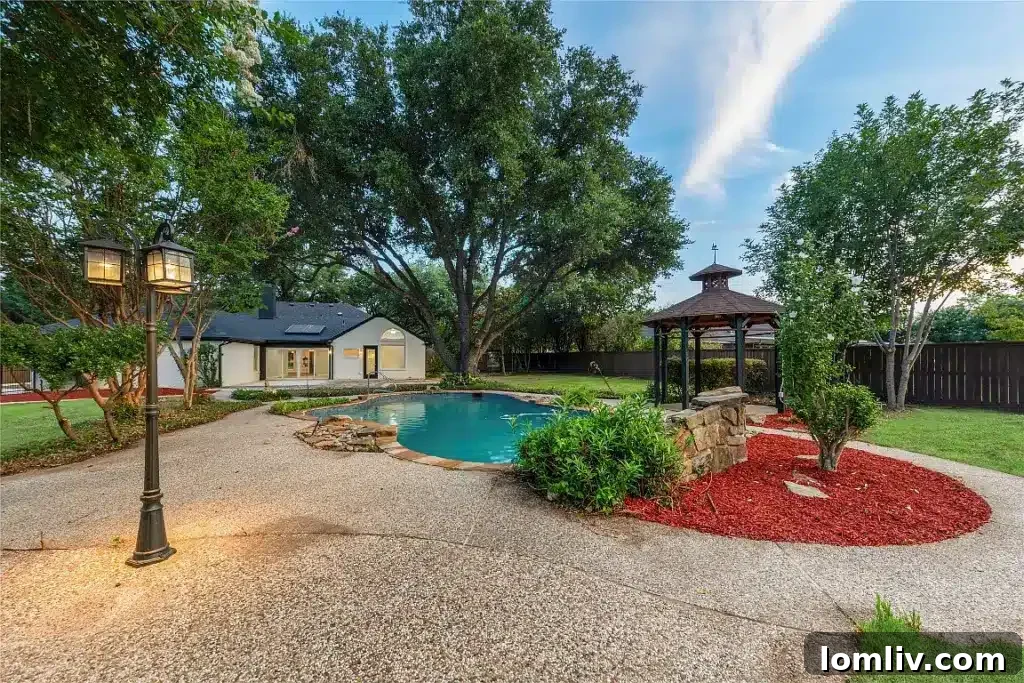 Sparkling swimming pool and outdoor living space at 609 Pecan Creek Drive, Sunnyvale, TX.