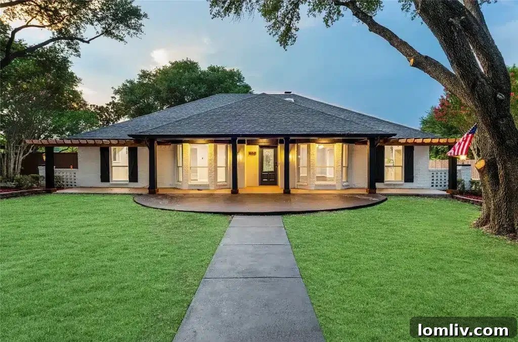 Exterior view of 609 Pecan Creek Drive, a luxury home in Sunnyvale, TX, featuring lush landscaping.