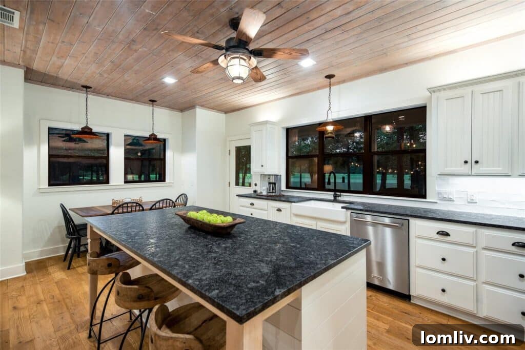 Spacious Living Room with Vaulted Ceilings and Stone Fireplace