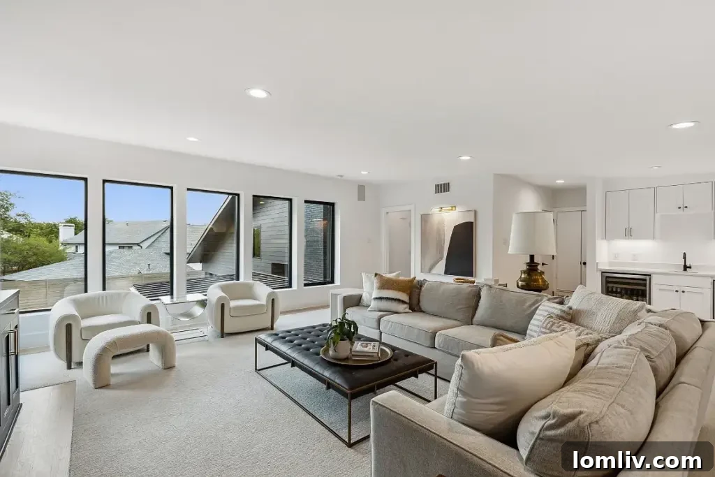 Upper level living space with a wet bar and impressive neighborhood views in a Dallas Midcentury Modern home.