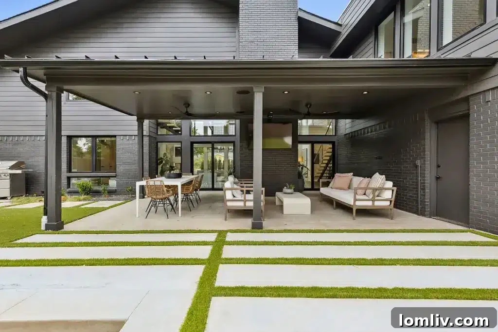 Modern exterior of a luxurious Dallas home with sophisticated landscaping and pool area.