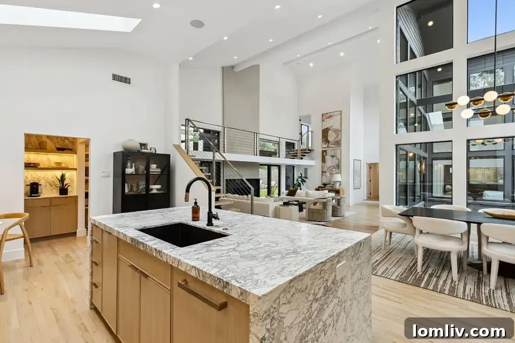 A unique front pivot door leading into an open-concept Midcentury Modern interior.