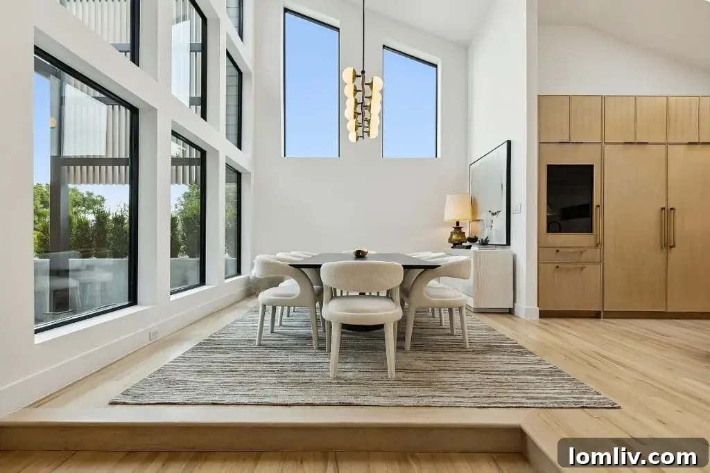 Open plan living space showcasing the wraparound balcony and modern interior design.