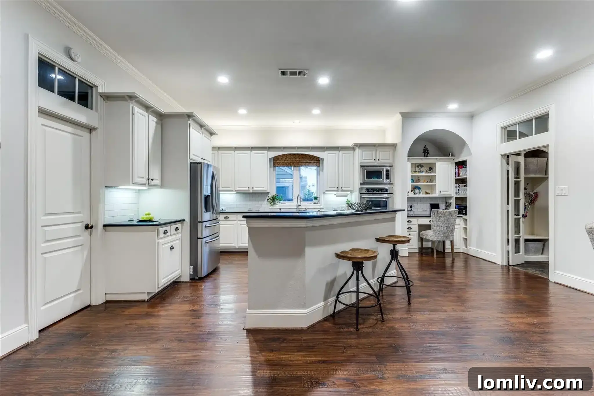 Snatch This Cape Cod-Style Home in The Peninsula Before I Do 5 Bright dining area with banquette seating.