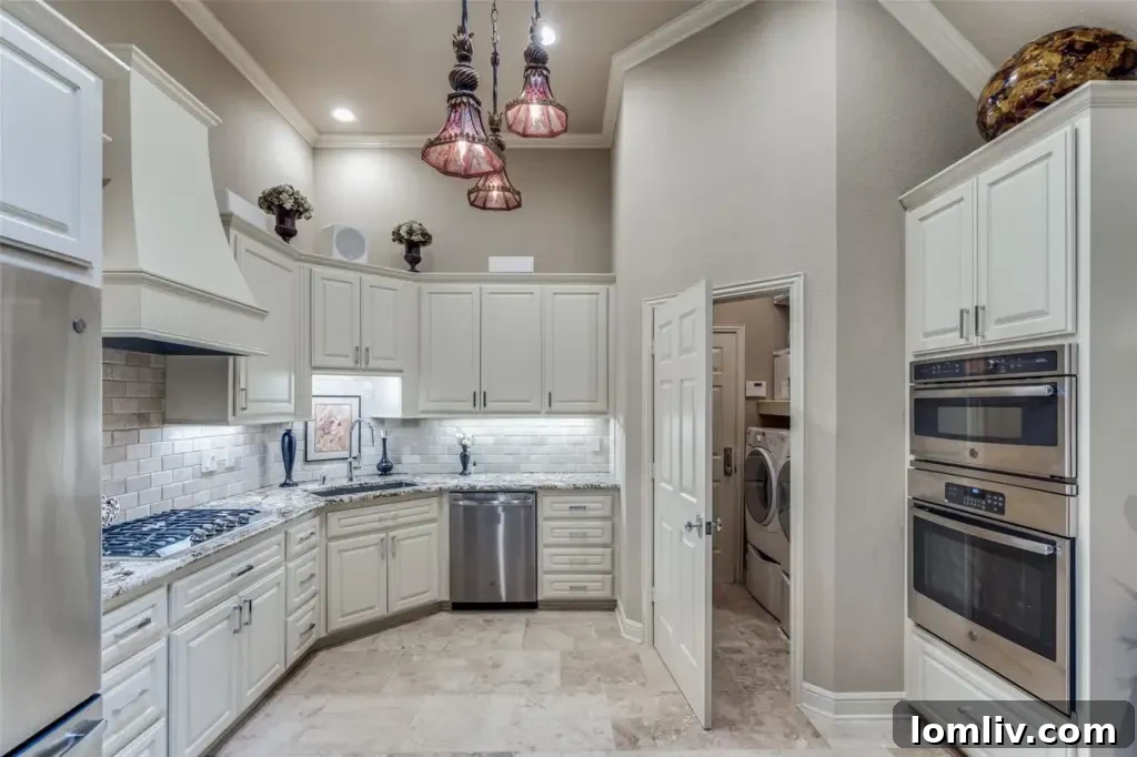 A bright and airy dining area adjacent to the kitchen, with stylish lighting fixtures and access to outdoor spaces.