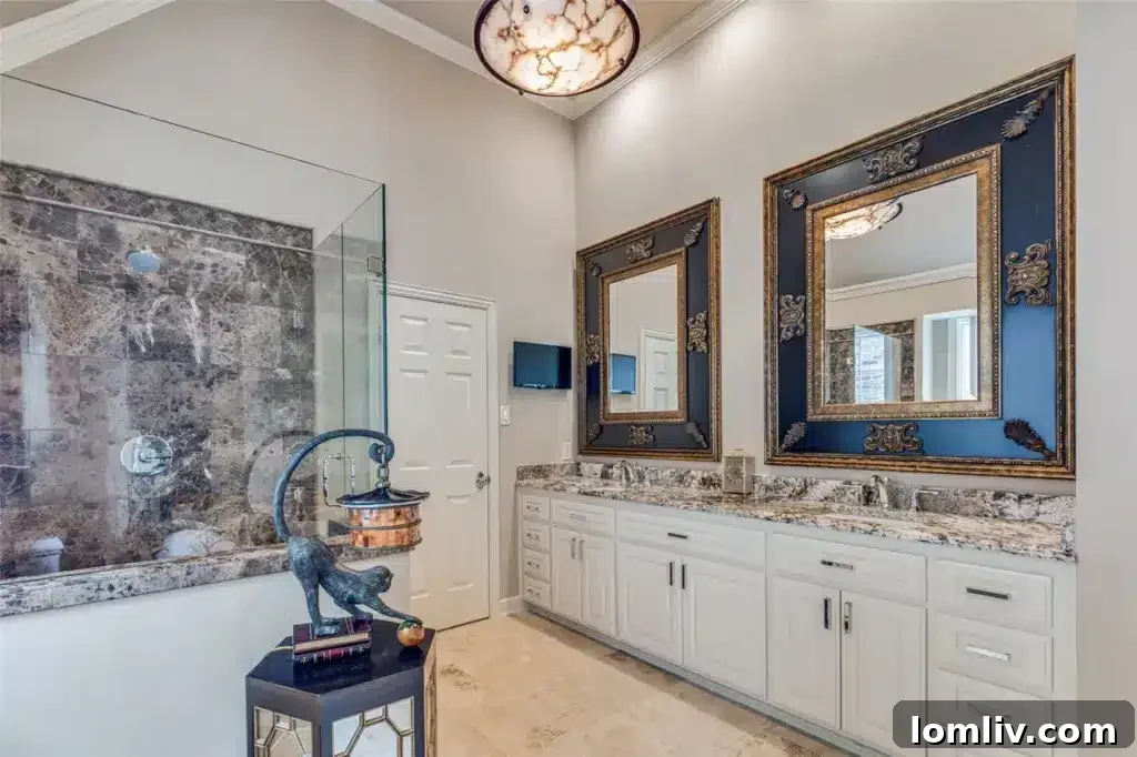 A luxurious master bathroom featuring a modern vanity with dual sinks, designer mirrors, and high-quality fixtures.