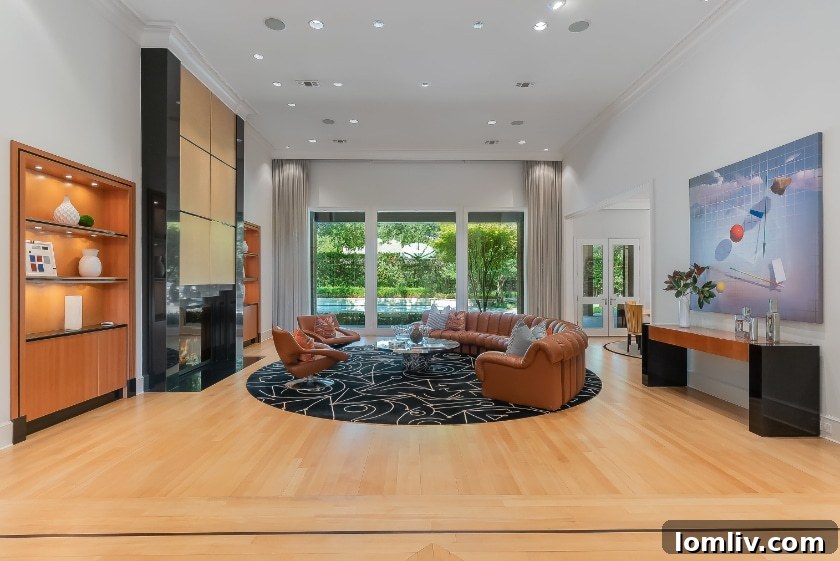 Elegant living area with high ceilings, modern fireplace, and exquisite furnishings, reflecting a blend of contemporary and traditional styles.