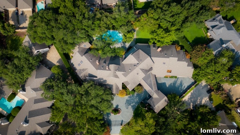 Expansive backyard with a sparkling pool, hot tub, lush turf grass, and a covered patio, perfect for outdoor living.