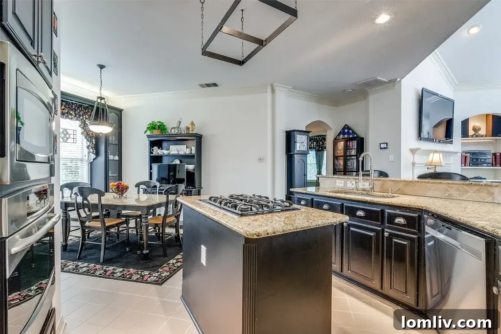 Holiday Shopping Head Start: Tour This Enclave at White Rock Home This Weekend 7 Modern kitchen with a gas cooktop, convection oven, and open access to living areas.