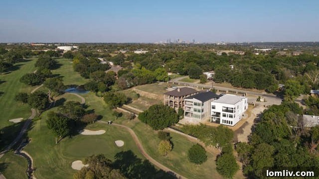 Stunning architectural exterior of the luxury Fort Worth home at twilight, showcasing its unique design and integration with the landscape
