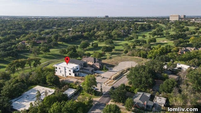 Aerial view of an exclusive gated enclave of luxury homes backing onto Ridglea Golf Course, Fort Worth