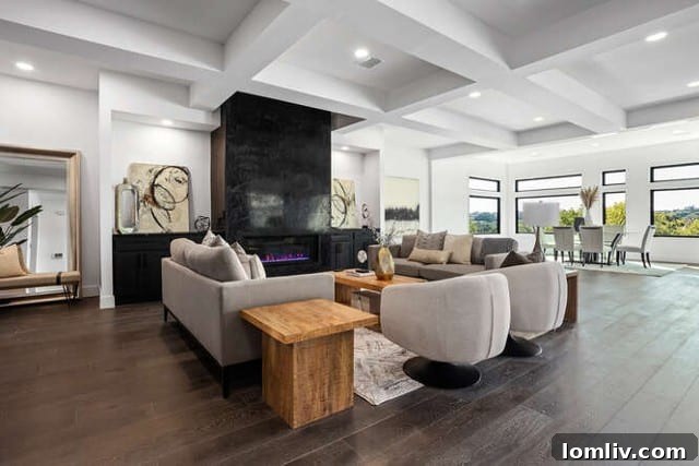Sophisticated living room on the main level of the Fort Worth home, showcasing wide engineered wood floors, large windows, and a fireplace with Venetian plaster