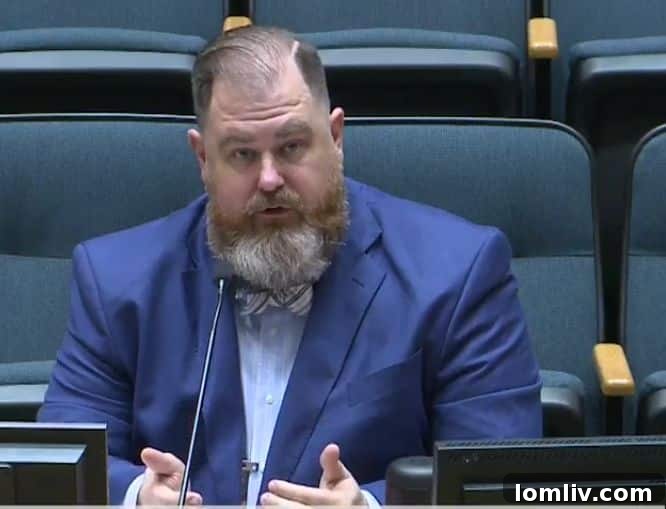 Thor Erickson, Assistant Director of Housing, speaking passionately about the need for streamlined housing programs during a committee briefing.