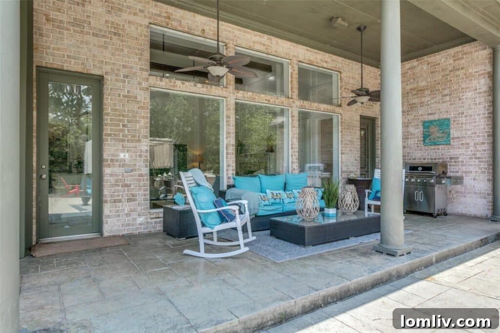 The Ultimate Score: A Dallas Cowboys Dream Home Lands at The Landing 18 Elegant Backyard with Lush Trees