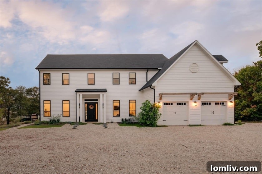 Luxurious custom home in Oak Point, Texas, overlooking a serene landscape.