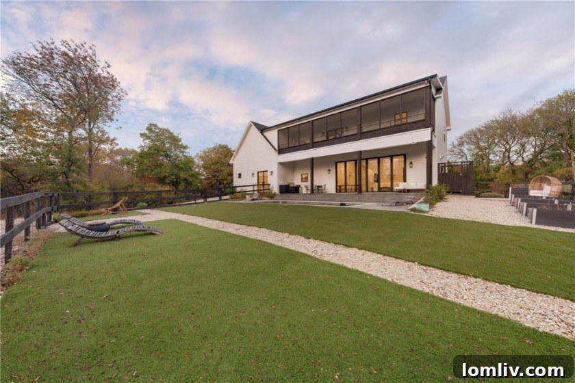 The grand entrance of the Oak Point custom home, situated at the end of a long, private driveway.