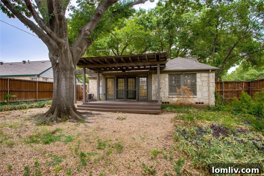 Stevens Park Village: A Charming Cottage Steeped in Character 9 Sunroom with Backyard Views Stevens Park Village