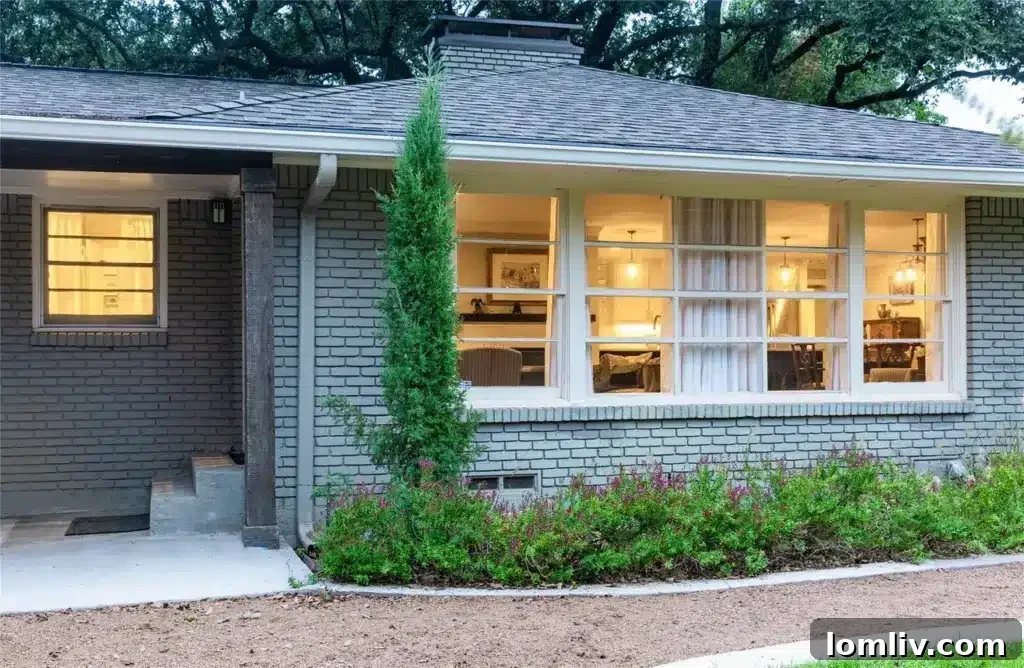 Preston Hollow's Midcentury: The Home That Weathered Judo Outlaws and Tornados 11 Well-appointed bedroom offering comfort and style, with hardwood flooring and plenty of natural light