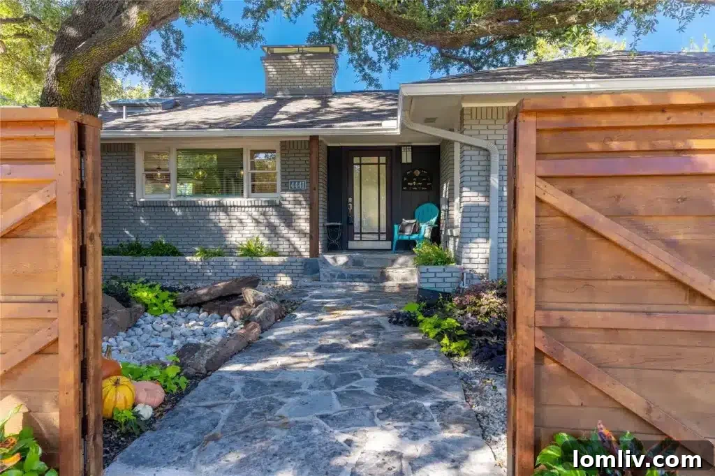 Preston Hollow's Midcentury: The Home That Weathered Judo Outlaws and Tornados 5 Inviting pathway leading to the front entrance of the Dallas home, surrounded by neatly manicured landscaping
