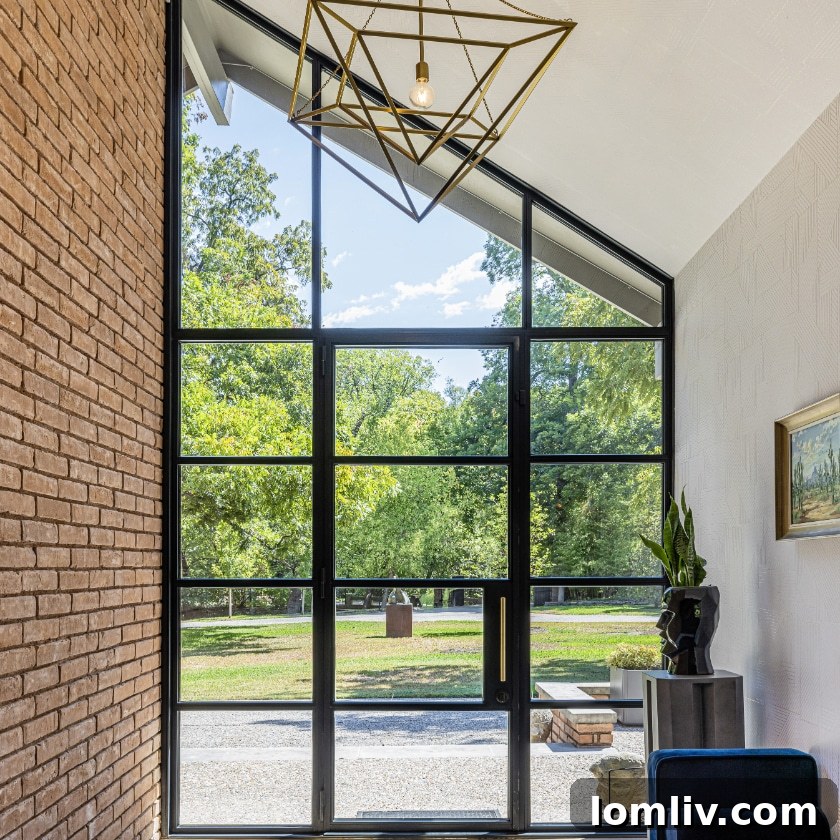 Oak Cliff Heritage Home Tour 2023: Architectural Treasures Along Rainbow Drive 5 Large windows and open spaces in the Rainbow Drive house blur the boundaries between the interior and exterior, inviting nature inside.