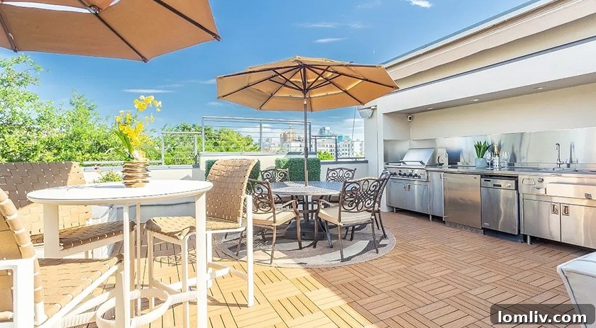 Elevated Living: Rooftop Terraces, Golf Simulators, and Walk-In Pantries Lead Home Trends 2 Stunning rooftop deck with panoramic city views, comfortable seating, and an outdoor fireplace, embodying modern luxury living.
